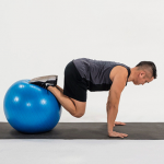 take-your-planks-to-the-next-level-with-the-stability-ball-knee-tuck